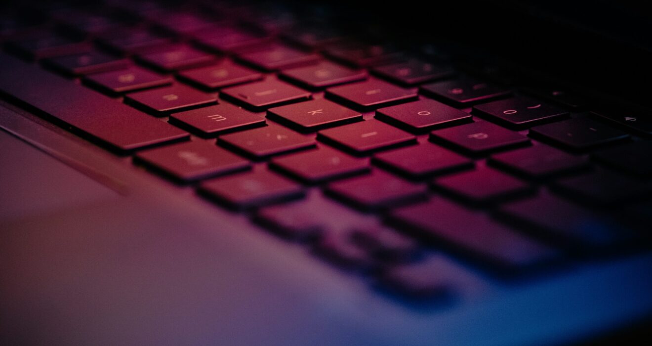 a-close-up-of-a-keyboard-with-a-blurry-background