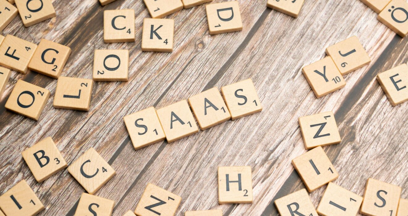 scrabble-letters-spelling-saas-on-a-wooden-tabl