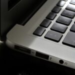 Free Detailed view of a silver laptop showing keyboard and multiple ports. Stock Photo